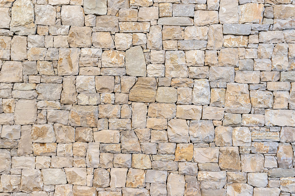 Wall texture with masonry of beige color. Concept background, texture, architecture.